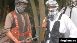 Militants of the Islamic Movement of Uzbekistan (IMU) pose for a photo in Afghanistan's northern Konduz Province.