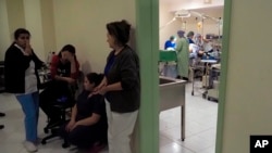NAGORNO KARABAKH -- Medical workers take refuge in a basement of a hospital as doctors perform surgery during shelling by Azerbaijan's artillery in Stepanakert, October 28, 2020.