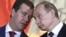Президент России Дмитрий Медведев (слева) и премьер Владимир Путин
