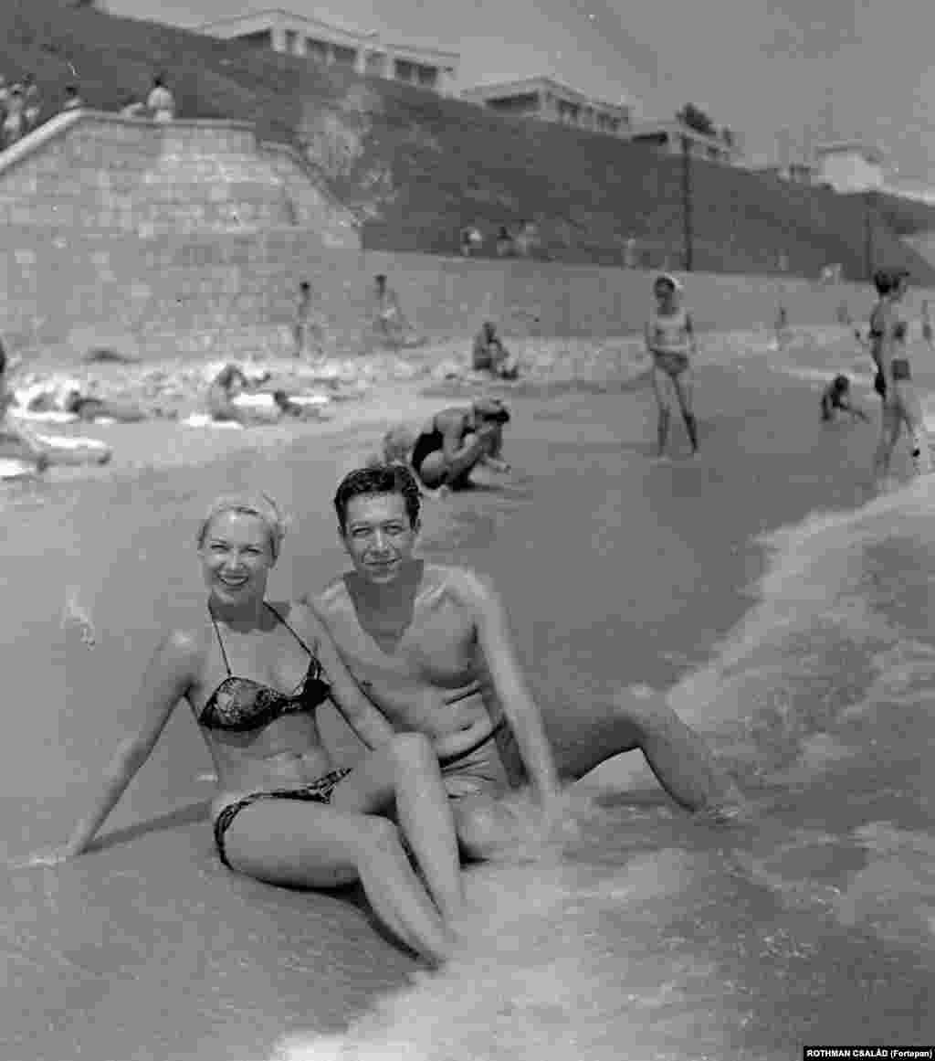 Actors Istvan Rozsos and Dorottya Geczi relax in the waves of the Black Sea near Constanta in 1959.