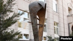 Armenia -- A statue symbolizing the national currency, the dram, outside the Central Bank building in Yerevan.