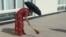 turkmenistan. woman with brooms are cleaning streets ahead of Elder's Council in Turkmenabat