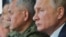 Орусиянын коргоо министри Сергей Шойгу жана Орусиянын президенти Владимир Путин.