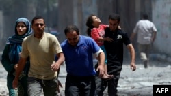 Палестинцы бегут из города Шиджаийя в секторе Газа, 20 июля 2014