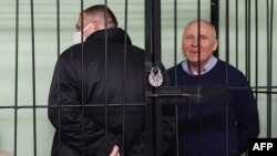 Мікола Статкевіч і Сяргей Ціханоўскі падчас судовага прысуду 14 сьнежня 2021 году