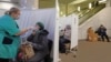 A woman undergoes COVID-19 testing at a "coronavirus express test point" in a subway station in Moscow on November 3. 