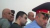 Armenia -- Gagik Matevosian (C) and other men accused of plotting to assassinate State Revenue Committee chief Gagik Khachatrian at the start of their trial, 8July 2010.