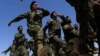 Afghan National Army officers march during a graduation ceremony at a training center in Herat in June. Afghan troops are increasingly taking control over security ahead of the planned withdrawal of foreign forces by the end of 2014.