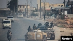 "Хайят Тахрир аш-Шам" согушкерлери Сирияда. 2024-жылдын 29-ноябры.