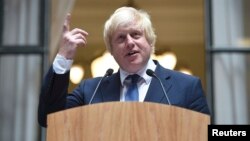 Boris Johnson addresses staff inside the Foreign Office in London on July 14, a day after being appointed Britain's Foreign Secretary. 