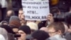 Один из лозунгов пикета против показа фильма "Анатомия протеста", прошедшего на Пушкинской площади 17 марта 2012 года.