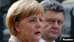 Канцлер Німеччини Ангела Меркель та президент України Петро Порошенко