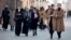 Women walk through a street in the Chechen capital, Grozny. In the past month, the republic's authorities have issued several new restrictions on women's clothing. 