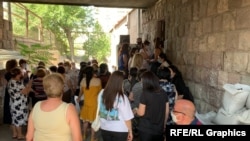 Armenia -- Schoolteachers wait outside a policlinic in Yerevan to get tested for COVID-19, September 9, 2020