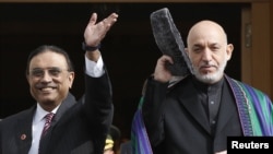 Pakistani President Asif Ali Zardari (left) told his Afghan counterpart, Hamid Karzai, that Pakistan was committed "to concrete action to eradicate the menace of terrorism and extremism."
