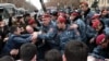 Police move to unblock a central Yerevan street where cafe employees held a protest, 14 March, 2019