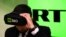 RUSSIA -- A man tries on a VR goggles at the stand of Russia's state-controlled broadcaster RT during the 10th Russian Internet Week in Moscow, November 1, 2017