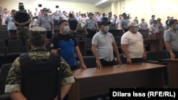 The courtroom listens as the judge delivers the verdicts in Shymkent on July 26.