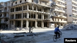 Разбураныя бомбамі будынкі ў сырыйскім горадзе Алепа