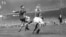 Chelsea's Reg Williams (right) rushes in to challenge Dynamo Moscow's Ivan Stankevich (left), deflecting the ball into the net for Chelsea's second goal, making the score 2-0.