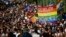 People march across the Szabadsag (Freedom Bridge) over the River Danube in downtown Budapest during a gay pride parade in Budapest in July. 