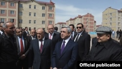 Armenia - President Serzh Sarkisian and Gyumri Mayor Vartan Ghukasian (R) inspect new apartment blocks constructed in Armenia's second largest city, 7Apr2012. 