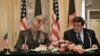 US commander in Afghanistan, General John Allen (left) and Afghan Defense Minister Abdul Rahim Wardak sign a security coordination agreement during a ceremony in Kabul on April 8.