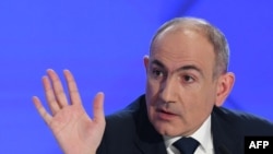 Armenia's Prime Minister Nikol Pashinyan gestures as he holds his annual press conference in Yerevan on January  31, 2025. (Photo by KAREN MINASYAN / AFP)