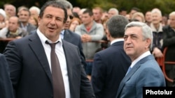 Armenian President Serzh Sarkisian (right) and businessman Gagik Tsarukian, head of the Bargavach Hayastan (Prosperous Armenia) party, attend the consecration of a new church built by Tsarukian in Abovian on May 14.