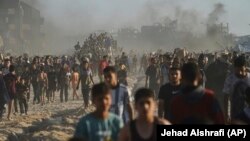 Գազայում պաղեստինցիները մարդասիրական օգնություն են ստանում, հունիս, 2025թ.