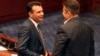 Macedonian Prime Minister Zoran Zeav (left) talks with leftist SDSM party lawmaker Tomislav Tuntev during a session for the ratification of the deal with Greece, in the parliament in Skopje on June 20.