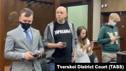 Sergei Smirnov (second from left) at his court hearing in Moscow on February 3. 