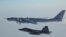 A Russian Tu-142 maritime reconnaissance aircraft (top) is intercepted near the Alaska coastline. (file photo)