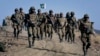 Pakistani troops patrol near the Afghan border. (file photo)