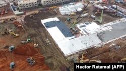 Չինաստան - Ուհան քաղաքում շտապ նոր հիվանդանոց են կառուցում՝ բուժելու նոր տիպի կորոնավիրուսով վարակվածներին, 27-ը հունվարի, 2020թ.