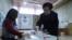 Armenia - A woman at a polling station in Yerevan votes in Armenian parliamentary elections, December 9, 2018.