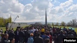 People walk to the Tsitsernakabert memorial in Yerevan on April 24 during an annual commemoration of the 1915 mass killings of Armenians in Ottoman Turkey. 