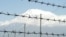 Barbed wire, pictured against the backdrop of Mount Ararat, marks Armenia's closed border with Turkey.