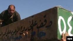 Похороны жертв крупного взрыва в шиитском районе Багдада, произошедшего в четверг