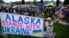 Demonstrators rally in support of Ukraine along a highway in Anchorage, Alaska, on the eve of the meeting on August 15 between the US and Russian presidents.