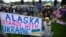 Demonstrators rally in support of Ukraine along a highway in Anchorage, Alaska, on the eve of the meeting on August 15 between the US and Russian presidents.