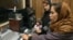 Two Afghan women work in a studio of Voice of Women, the first radio station in Afghanistan to be dedicated to the interests of women, in Kabul in 2005.