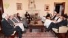 Afghan President Hamid Karzai (center right) holds talks on September 15 to try and resolve Afghanistan's crisis over a disputed presidential election. 