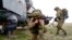 Russian troops take part in drills in Crimea, which Moscow forcibly seized from Ukraine in 2014. 