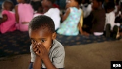 Больной СПИДом ребенок в приюте Йоханнесбурга, ЮАР